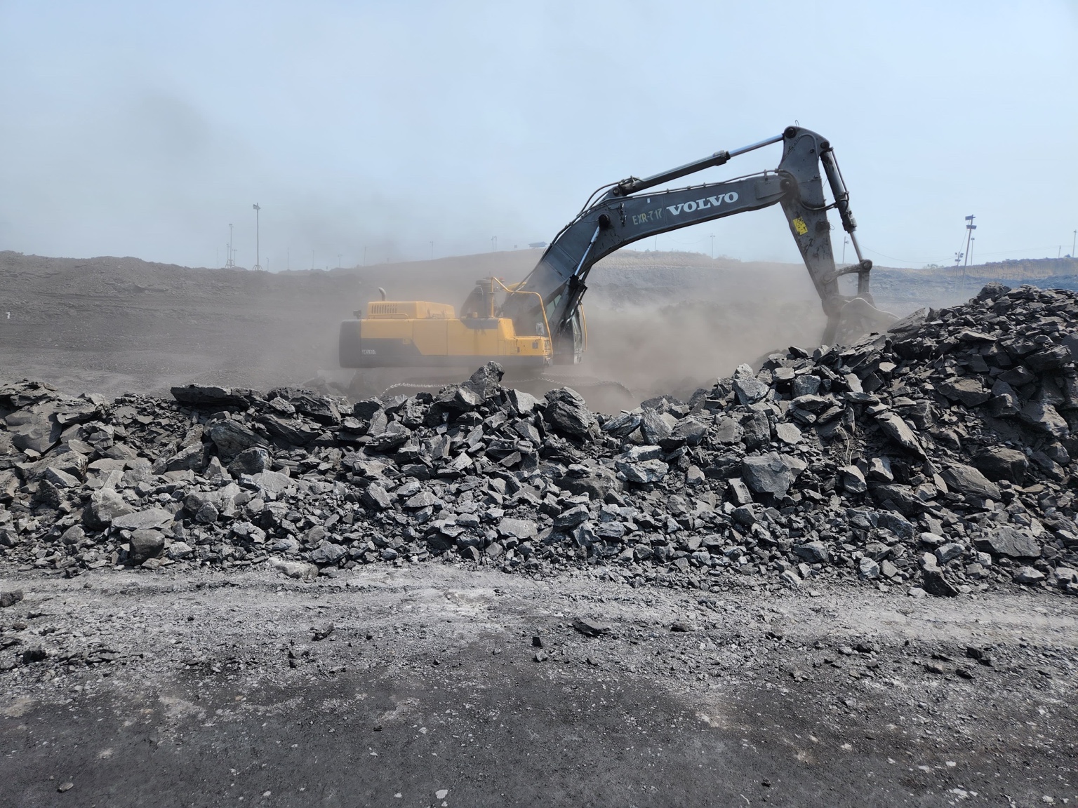 Volvo excavator working on a rock excavation site